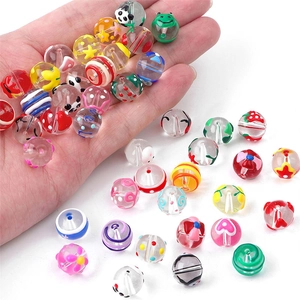 Hand-painted glass beads with cartoon patterns like panda and strawberry for DIY jewelry