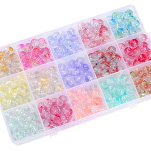 Colorful mixed glass beads in 15-grid plastic storage box for DIY jewelry making