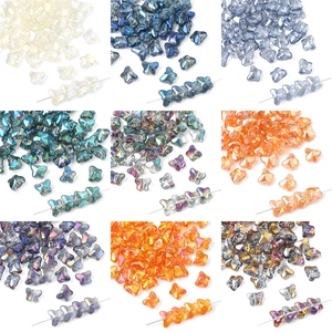 Detail showing nine colorful crystal butterfly glass beads with AB coating for DIY jewelry