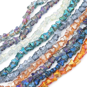 Macro shot of colorful iridescent butterfly glass beads for DIY jewelry making