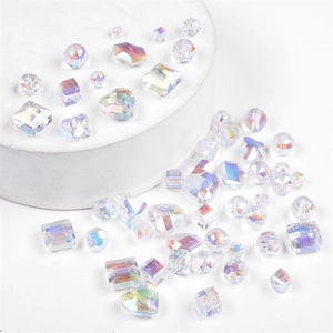 Macro shot of iridescent AB crystal beads in heart and geometric shapes for DIY jewelry
