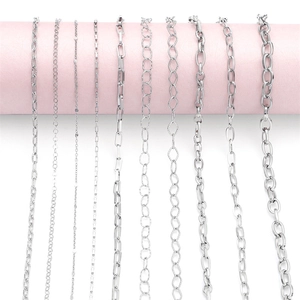Various 304 stainless steel chain styles for DIY jewelry making on pink display stands