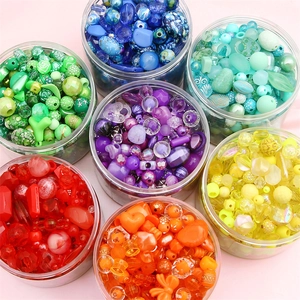 DIY colorful bead assortment kit in seven transparent storage jars for handmade jewelry