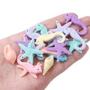 Detailed view of colorful sea animal acrylic beads for DIY jewelry and necklaces