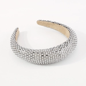 Close-up of luxury sponge headband with pavé set pearls and rectangular crystal rhinestones