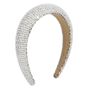 Detail of wide padded headband with sparkling white rhinestones and pearls on grid pattern