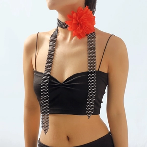 Exaggerated retro mesh choker with sparkling rhinestones and a large red fabric flower