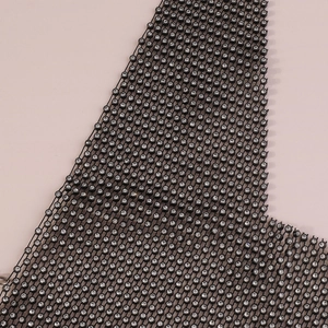 Detailed close-up of a black mesh body chain featuring sparkling rhinestone accents