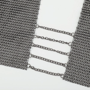 Detailed close-up of a sexy black mesh body chain with crystals and parallel metal links