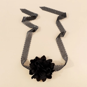 Macro detail of handmade black flower choker with sparkling rows of crystal rhinestones