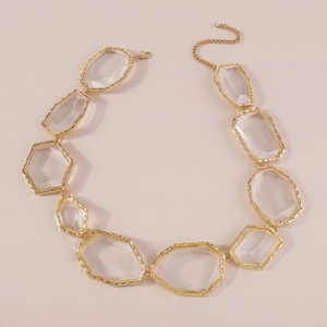 Detail of geometric resin necklace with gold hammered metal frame and lobster clasp