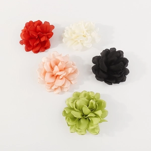 Set of five handmade fabric rose brooches in red, white, pink, black, and green