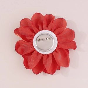 Detailed back view of a handmade red fabric rose brooch with a secure metal pin clasp