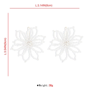 Detailed dimensions of white beaded flower earrings showing 8cm width and 9cm height