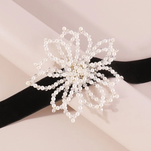 Elegant floral choker necklace with white pearls, crystals, and black velvet ribbon
