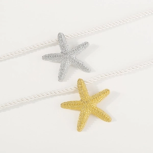 Colgante de estrella de mar y pendientes con cristales en acabado dorado y plateado