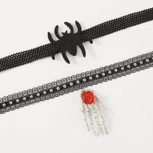 Detail of gothic Halloween choker with black spider and skeletal hand rose charm