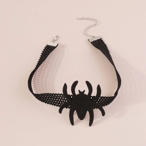 Detailed close-up of gothic black lace choker featuring a large dark spider centerpiece