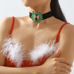 Detailed close-up of green enamel flower petals on a black velvet choker necklace