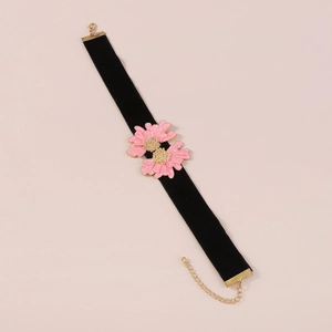 Detail of black velvet choker with pink daisy enamel charms and gold-tone lobster clasp