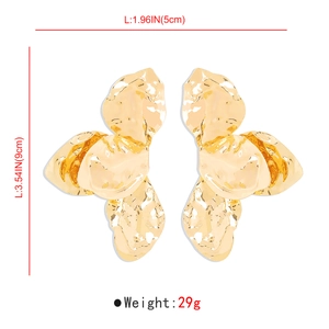 Detailed view of oversized gold petal earrings showing 9cm by 5cm dimensions and weight