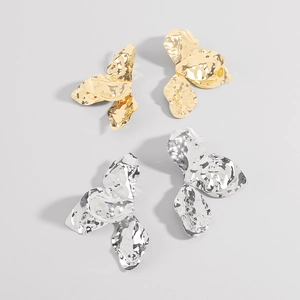Abstract metallic flower earrings in gold and silver with textured crinkle finish