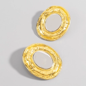 Exaggerated oval metal earrings with hammered texture and two-tone gold-silver finish