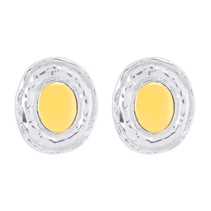Detail of oval earrings with hammered silver texture and yellow enamel center