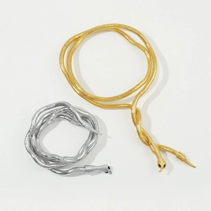 Flexible Schlangenkette und Gürtel in Gold und Silber mit Edelsteinaugen und Metallstruktur
