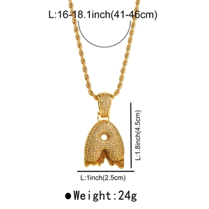 Macro detail of gold hip hop letter A pendant with zircons and drippy lava design on rope chain