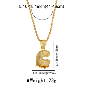 Detailed view of gold twisted chain necklace with zirconia letter C lava pendant