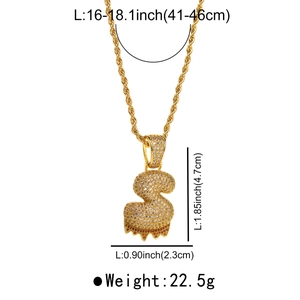 Detail showing the iced-out dollar sign pendant dimensions and twisted chain on gold necklace
