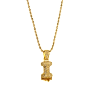 Close-up of gold hip-hop letter I pendant with sparkling cubic zirconia on rope chain