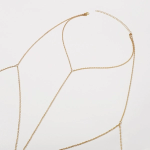 Gouden lichaamsketting plat liggend met verstelbare sluiting en fijne schakels