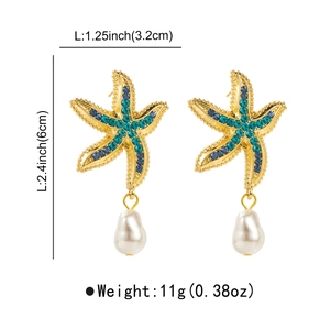 Détail des boucles d'oreilles étoile de mer et perle avec dimensions en pouces et cm