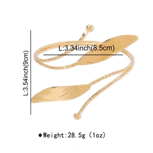 Detailed view of adjustable gold leaf arm cuff featuring hammered texture and size labels