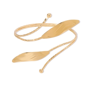 Detailed view of adjustable golden leaf arm cuff bracelet with twisted metal texture