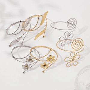 Detailed set of adjustable gold and silver leaf and floral arm cuffs for women