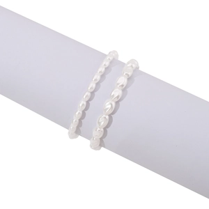 Close-up of double-layer white baroque pearl elastic bracelets with natural luster