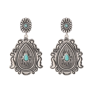 Vintage bohemian drop earrings with teardrop turquoise stones in carved silver finish