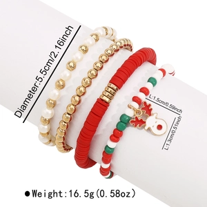 Detailed view of four Christmas stretch bracelets with beads and a reindeer enamel charm