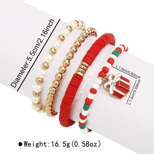Detail view of four Christmas beaded bracelets with gift box charms on white stand