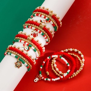 Detailed macro of Christmas charm bracelets with snowman, snowflake and reindeer pendants