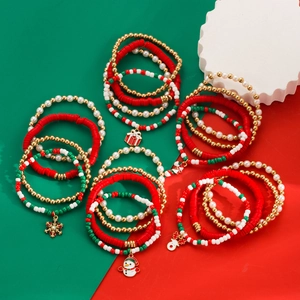 Detail view of colorful Christmas beaded bracelets with snowflake and elk charms