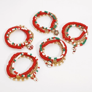 Detailed view of five Christmas beaded bracelets with festive charms and colorful pearls