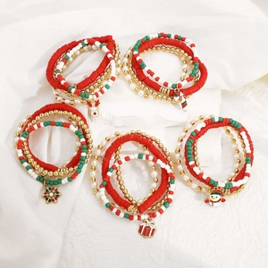 Detail of Christmas beaded bracelet set with Santa, deer and snowflake alloy charms