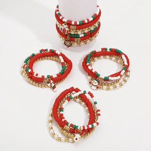 Detailed set of Christmas beaded bracelets featuring festive charms and colorful beads