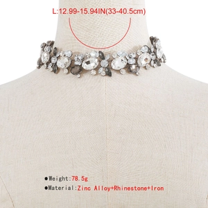 Close-up of vintage choker necklace showing dimensions 33-40.5cm and crystal details