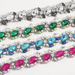 Detailed view of floral crystal necklaces with colorful oval gemstones and rhinestones