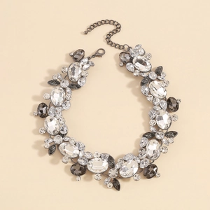 Detailed view of the statement necklace featuring gray crystals and lobster clasp